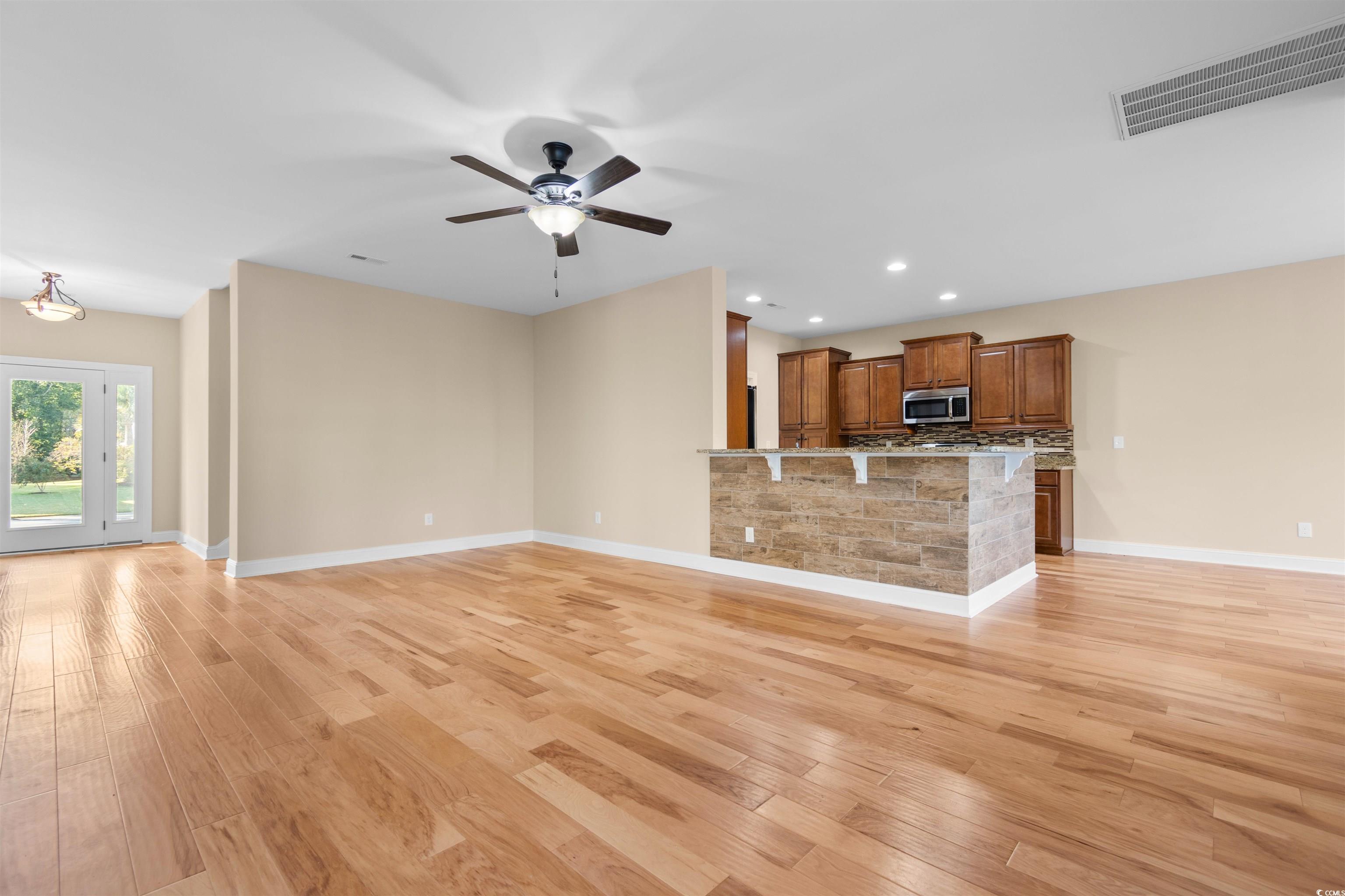 373 Graytwig Circle Murrells Inlet, SC 29576 - Photo 8 of 39 Unfurnished living room with ceiling fan and light