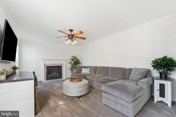 a view of a hallway with windows and entryway