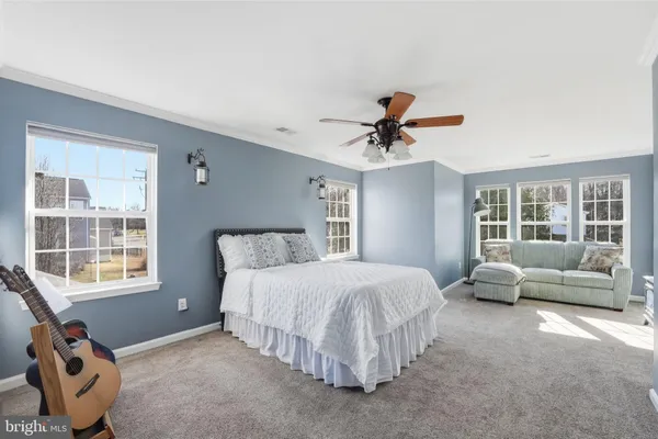 a bathroom with double vanity sinks and a mirror