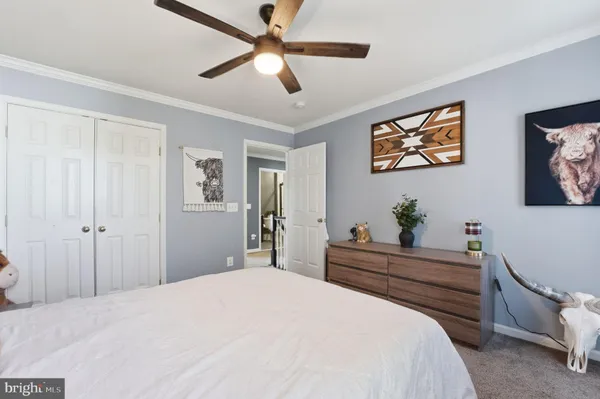 a bed room with a bed and a chandelier