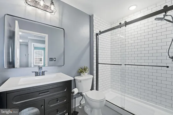 a front view of a house with a lots of flower plants