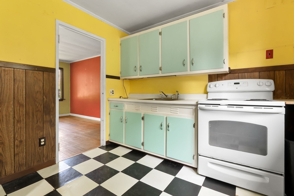 71 Union Street Hamilton, MA 01982 - Photo 8 of 21 a kitchen with a stove top oven and cabinets