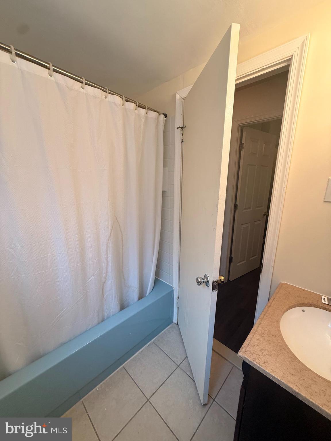 216 Boro Road, Unit A Secane, PA 19018 - Photo 22 of 26 a bathroom with a sink and a mirror