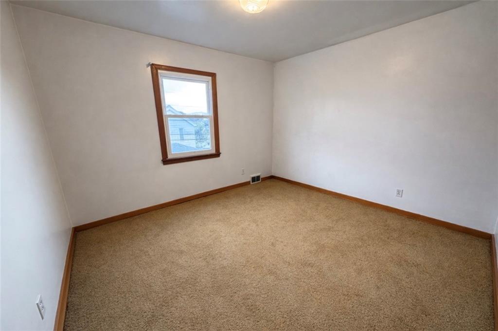 309 Emerson Street Vandergrift, PA 15690 - Photo 17 of 36 an empty room with a window