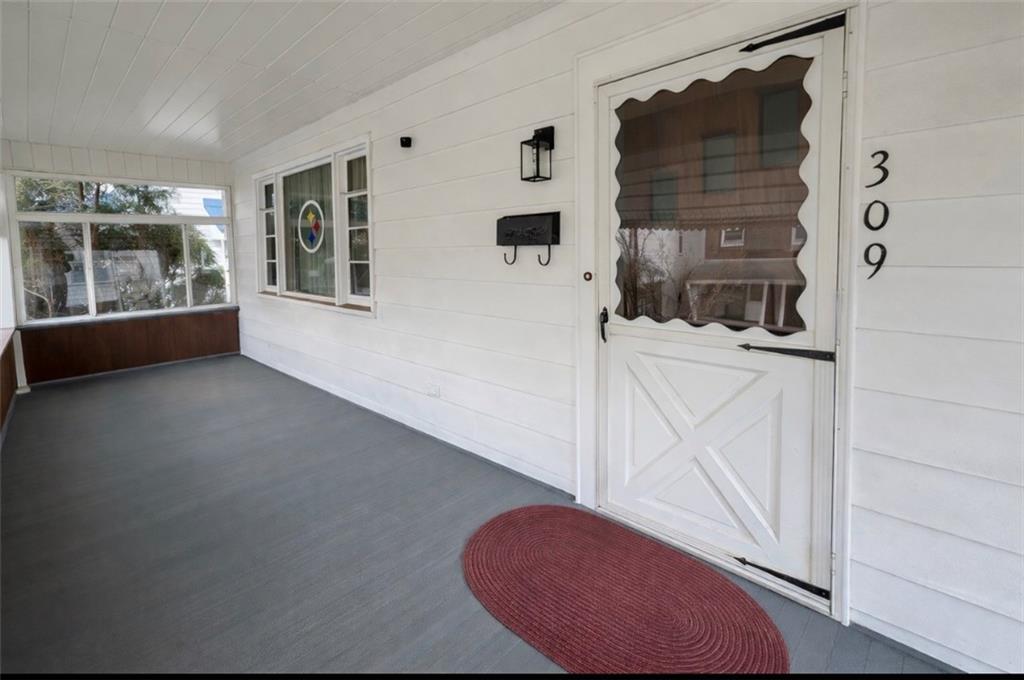 309 Emerson Street Vandergrift, PA 15690 - Photo 2 of 36 a view of a livingroom with furniture and windows
