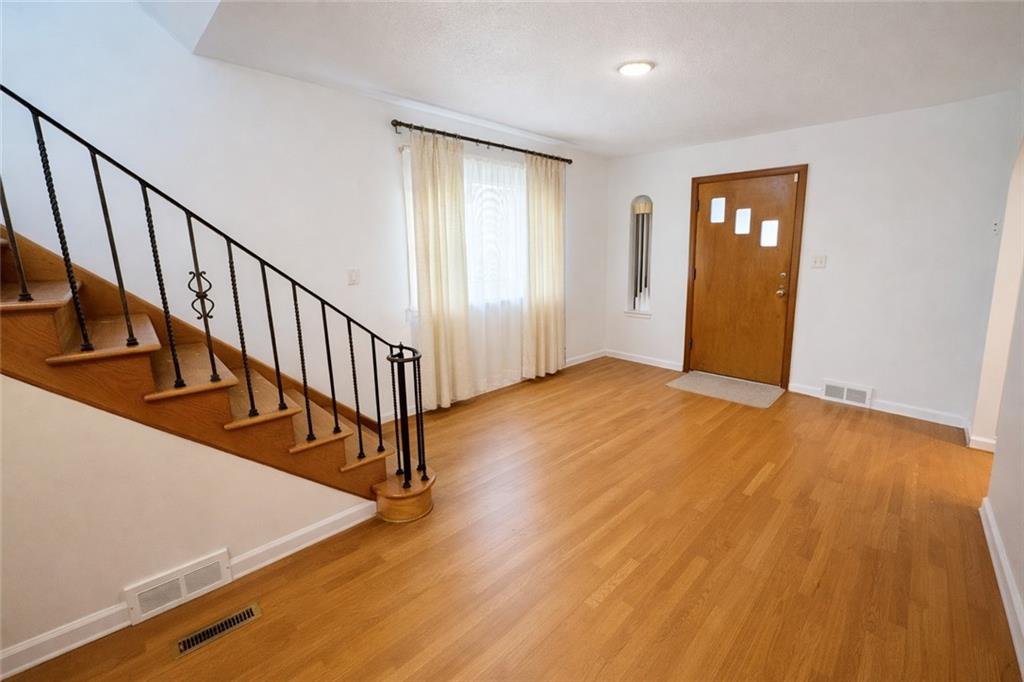 309 Emerson Street Vandergrift, PA 15690 - Photo 3 of 36 a view of an entryway with wooden floor