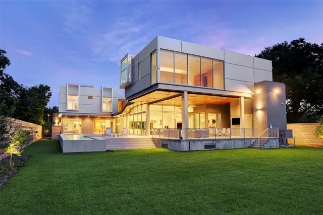 a view of a patio with couches and table with potted plants
