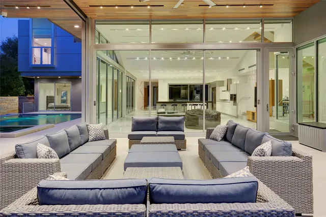 a view of swimming pool with outdoor seating