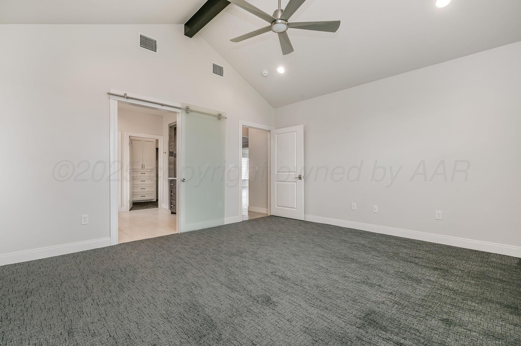9734 Cicada Trail Amarillo, TX 79119 - Photo 14 of 34 an empty room with ceiling fan and window