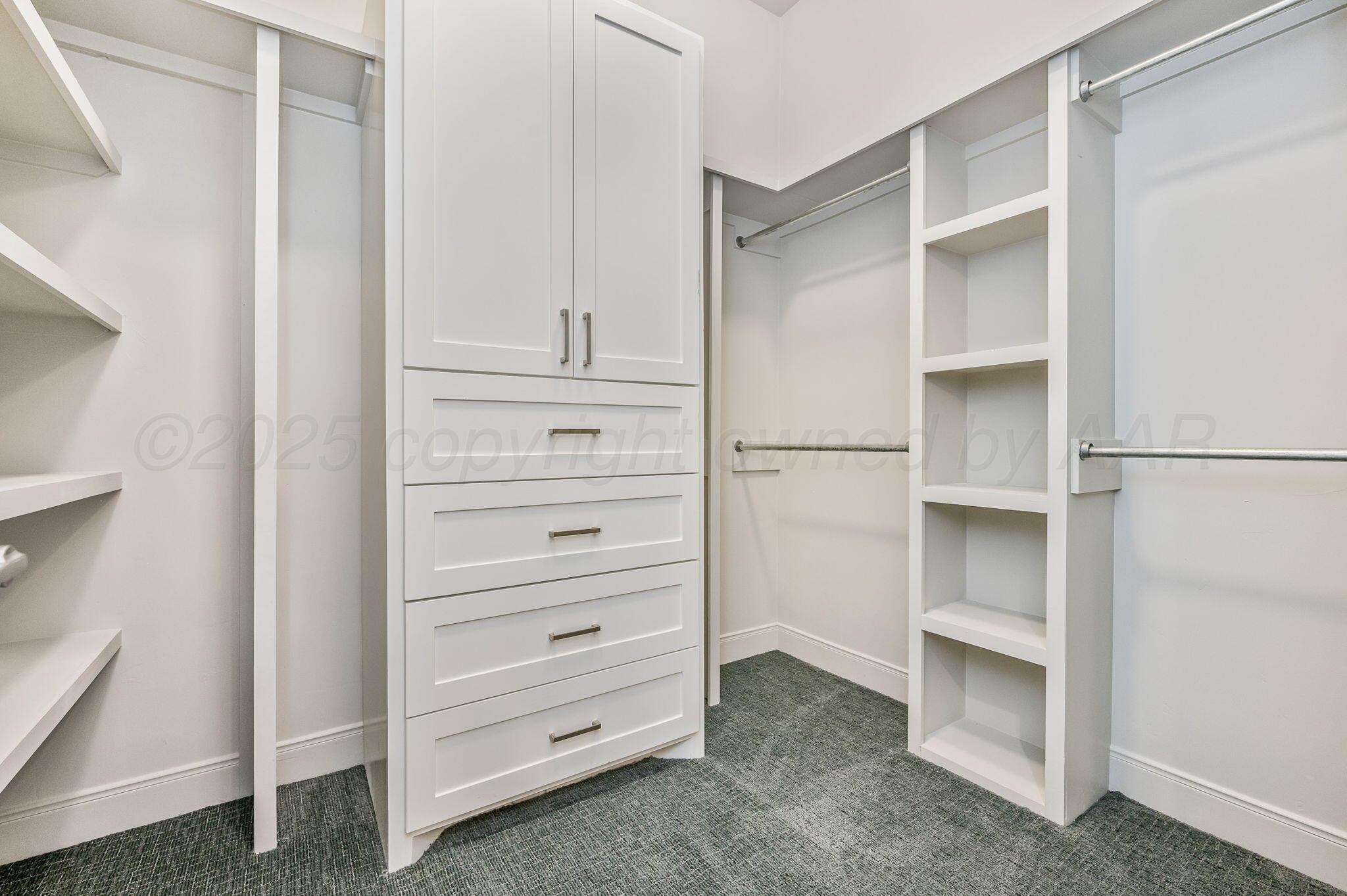 9734 Cicada Trail Amarillo, TX 79119 - Photo 15 of 34 a view of an empty walk in closet