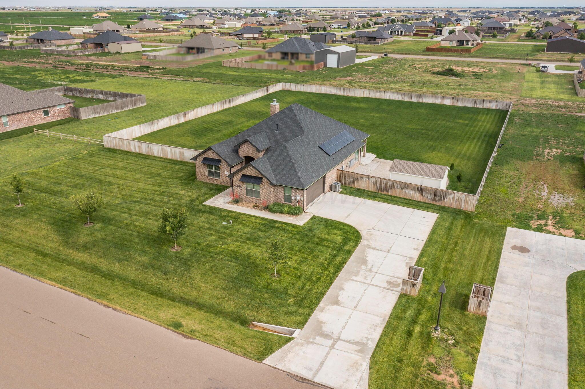 9734 Cicada Trail Amarillo, TX 79119 - Photo 2 of 34 an aerial view of a house with a big yard