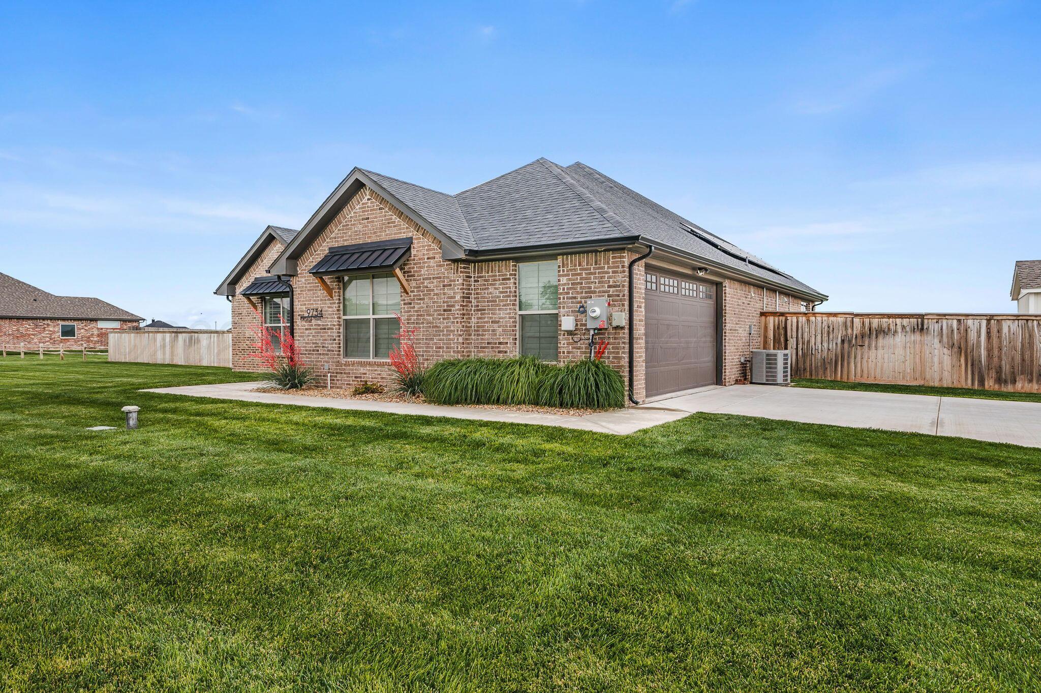 9734 Cicada Trail Amarillo, TX 79119 - Photo 29 of 34 a front view of house with yard and green space