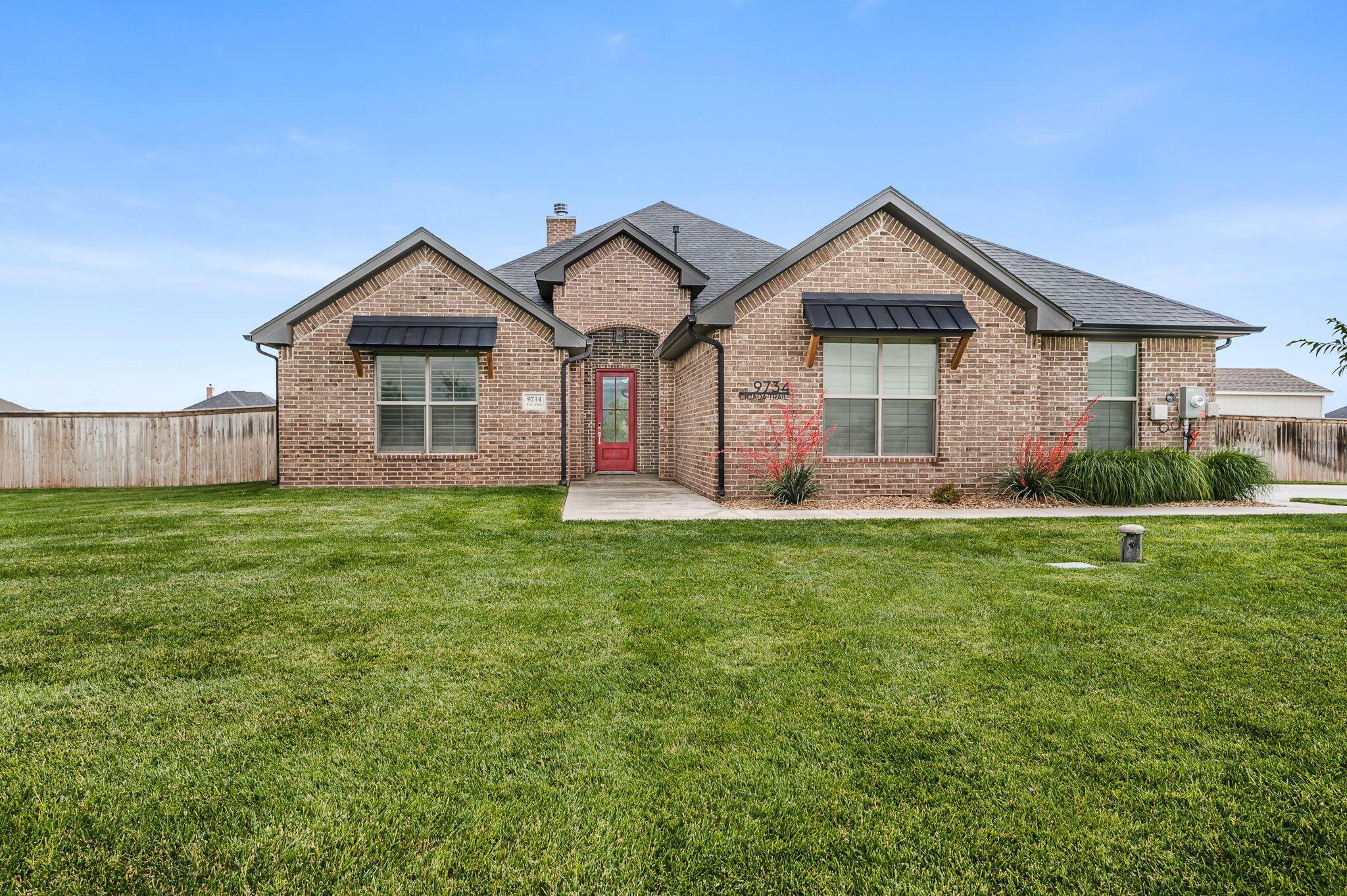 9734 Cicada Trail Amarillo, TX 79119 - Photo 30 of 34 a front view of house with yard and green space