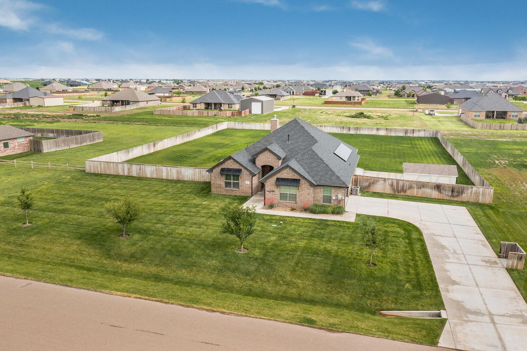 9734 Cicada Trail Amarillo, TX 79119 - Photo 34 of 34 an aerial view of a house with a ocean view