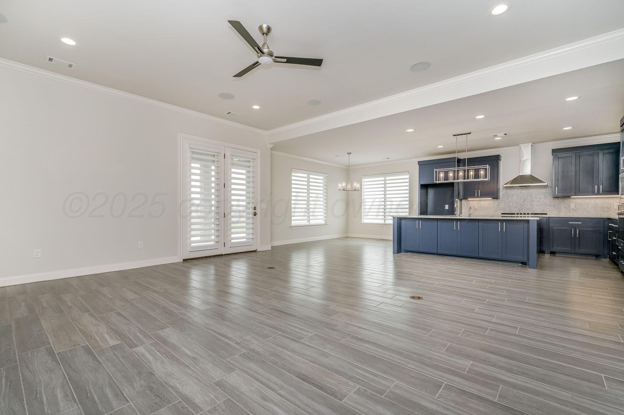 9734 Cicada Trail Amarillo, TX 79119 - Photo 6 of 34 a view of kitchen and hall with wooden floor