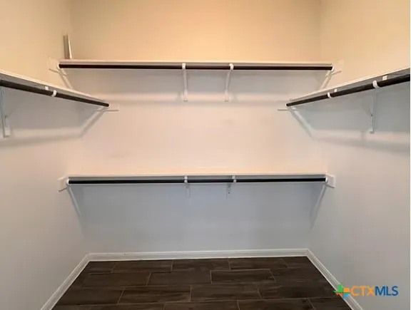 a view of an empty walk in closet