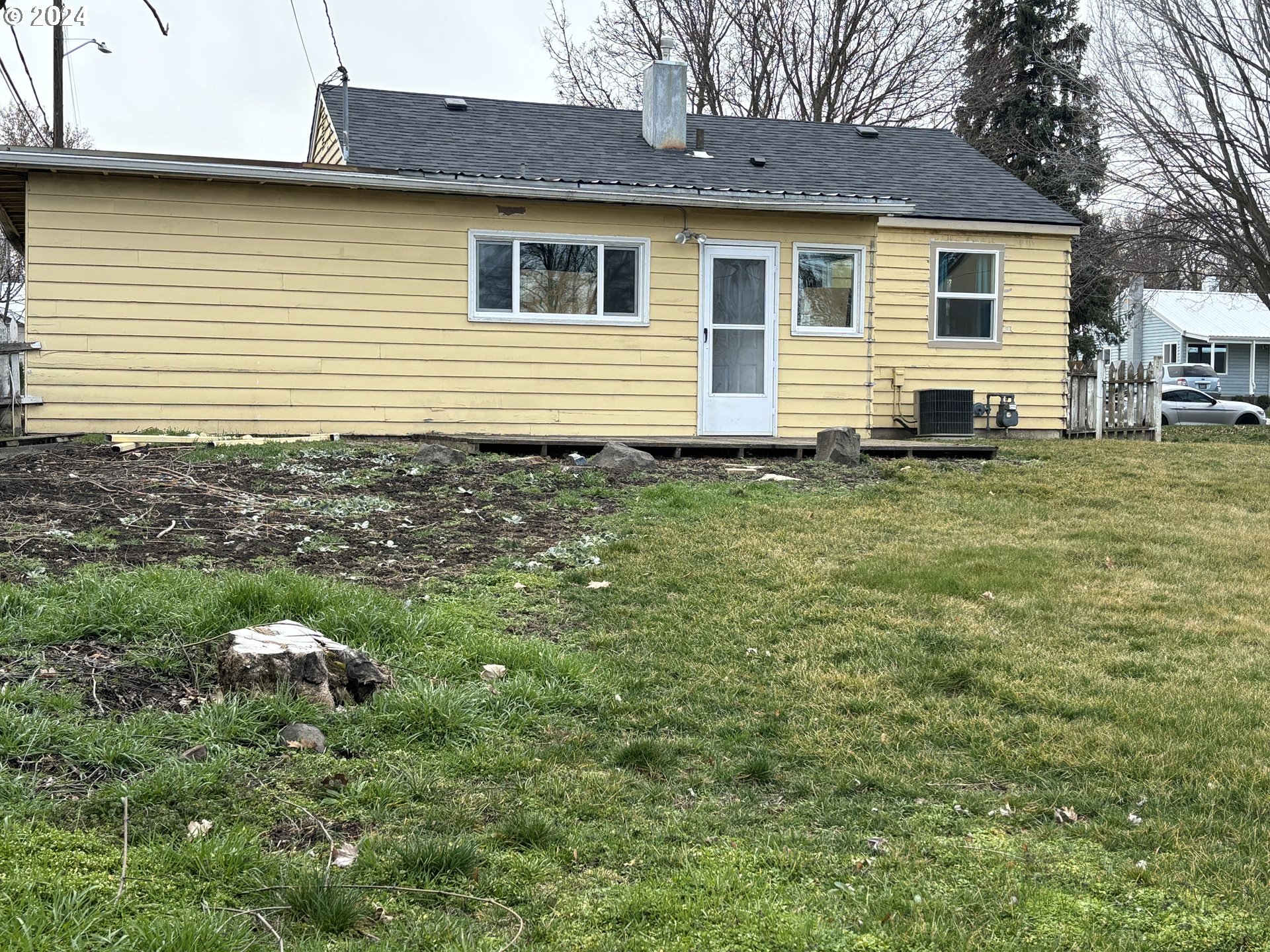 3021 Southwest Isaac Avenue Pendleton, OR 97801 - Photo 2 of 14 a backyard of a house with seating space