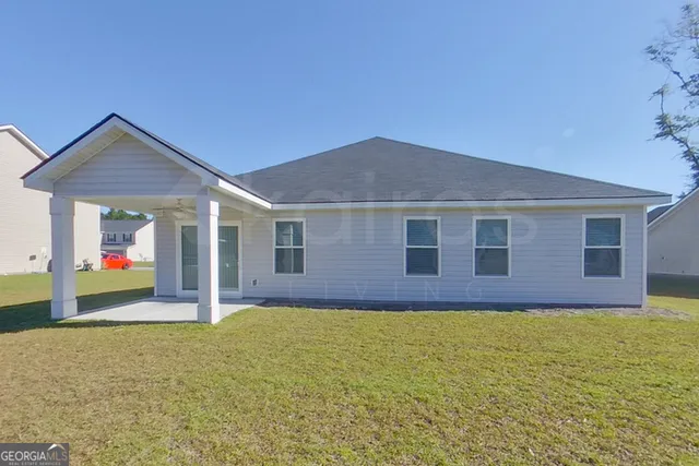 a front view of house with yard and porch
