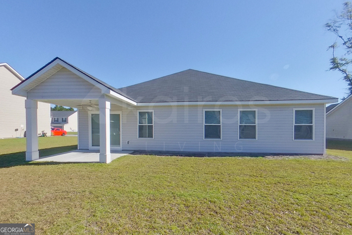 106 Ebenezer Blf Way Springfield, GA 31329 - Photo 17 of 19 a front view of house with yard and porch
