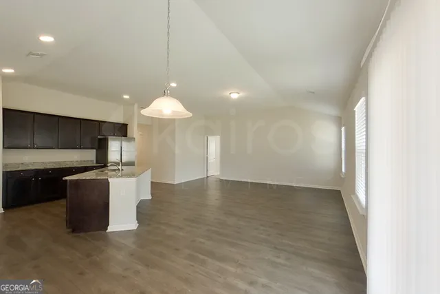 a view of kitchen with sink microwave and stove