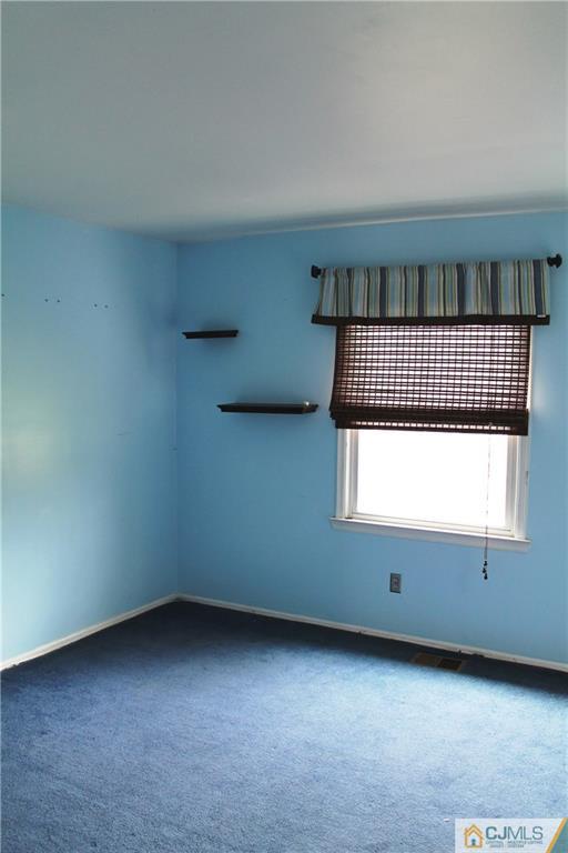 59 La Rue Lane, Unit 59 East Brunswick, NJ 08816 - Photo 15 of 17 an empty room with a window