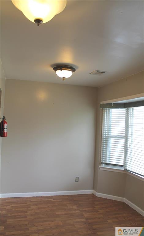 59 La Rue Lane, Unit 59 East Brunswick, NJ 08816 - Photo 3 of 17 a view of an empty room with a window