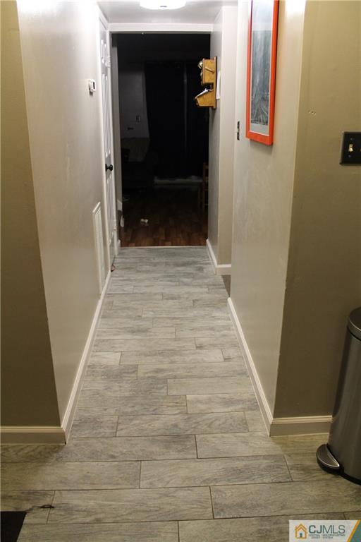 59 La Rue Lane, Unit 59 East Brunswick, NJ 08816 - Photo 5 of 17 a view of a hallway