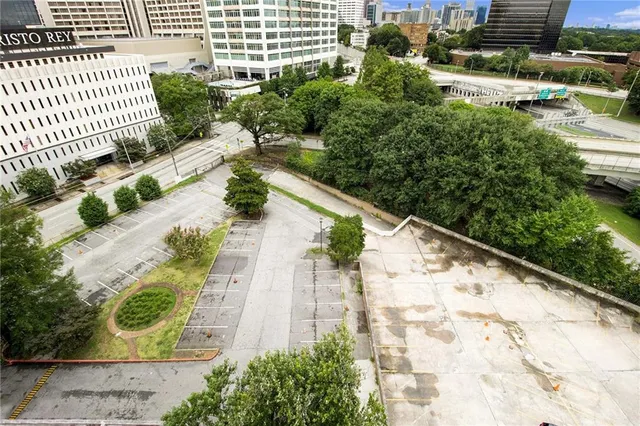 an outdoor space with furniture and umbrella