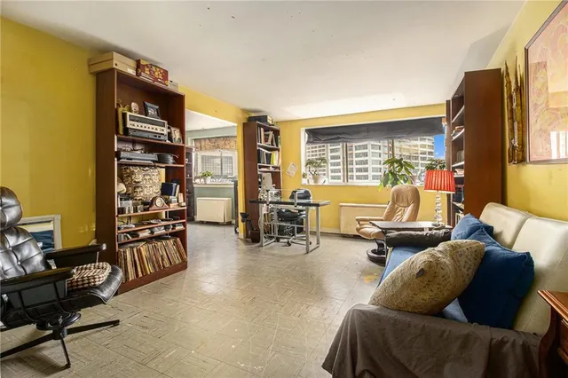 a living room with furniture and flat screen tv