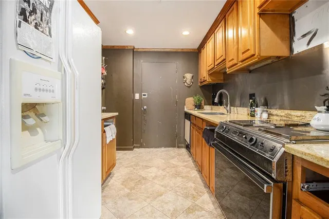a kitchen with a stove and a refrigerator
