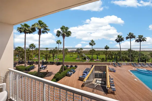 a view of a balcony and ocean view