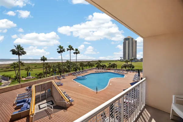 a view of swimming pool from a balcony