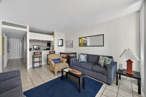 a living room with furniture and a rug