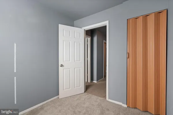 a view of a hallway with closet area