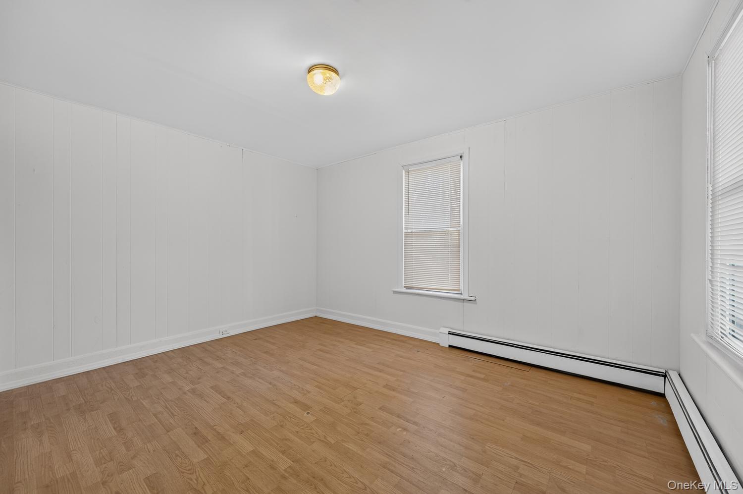 49 Cedar Street Babylon, NY 11702 - Photo 10 of 20 a view of a room with wooden floor