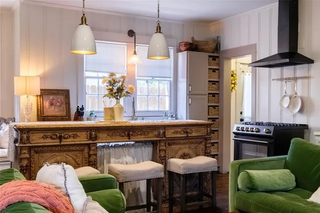 a view of kitchen with furniture and chandelier