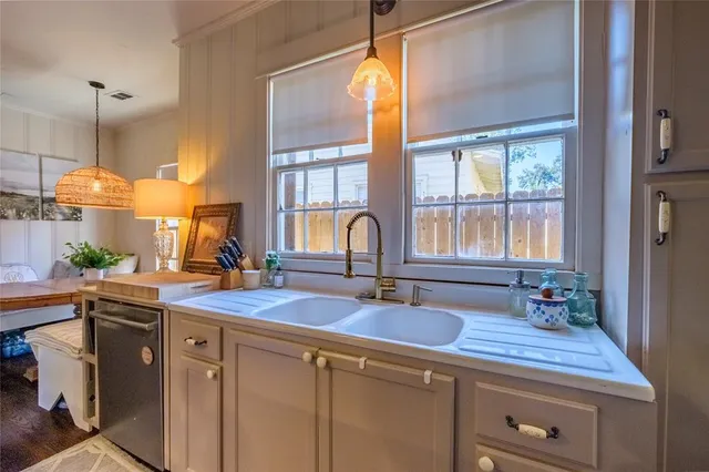 a kitchen with sink and window