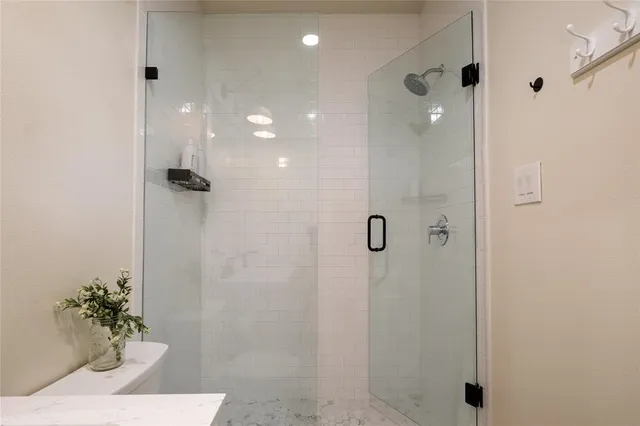 a bed room with a bed and a chandelier