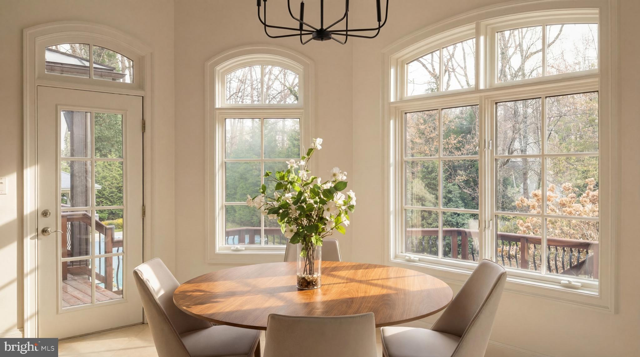 9250 Persimmon Tree Road Potomac, MD 20854 - Photo 24 of 47 a view of a dining room with furniture wooden floor and a chandelier