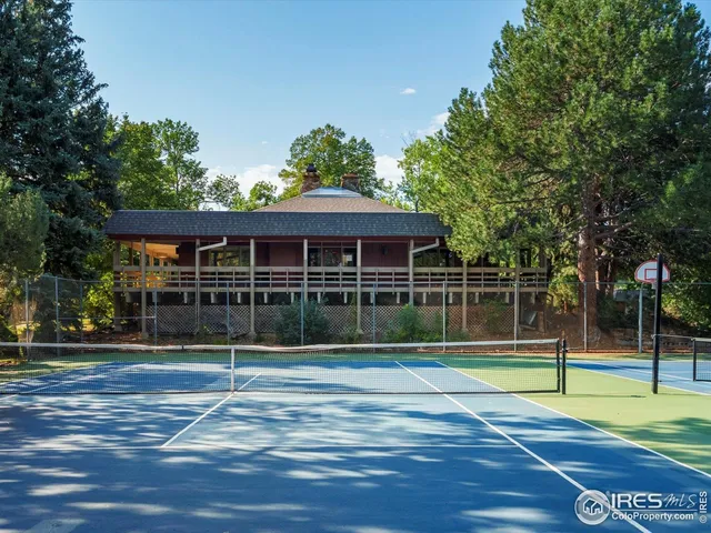 a view of a car park in front of a house