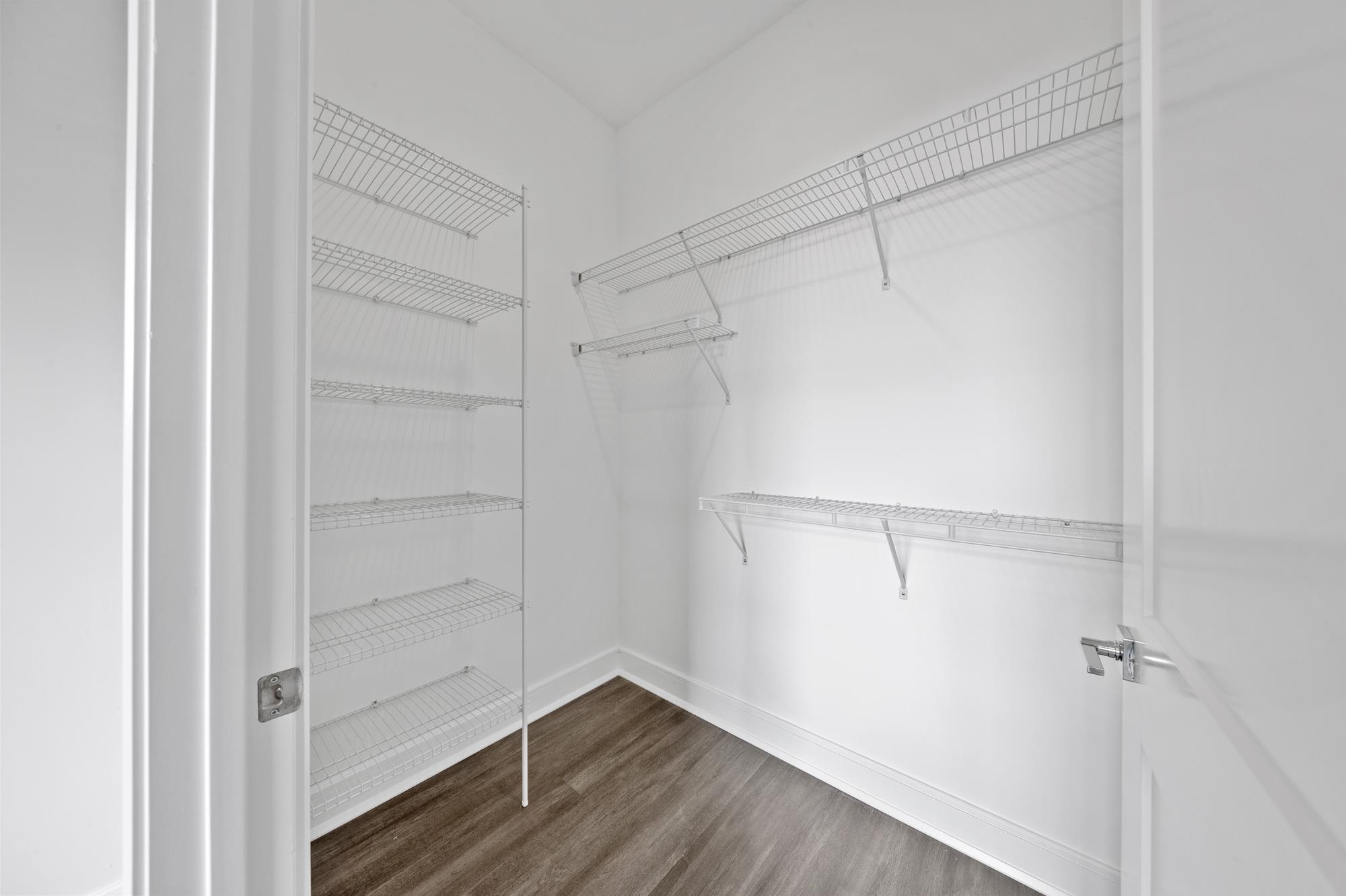 121 34th Street, Unit 415 Union City, NJ 07087 - Photo 9 of 41 a view of walk in closet with empty racks