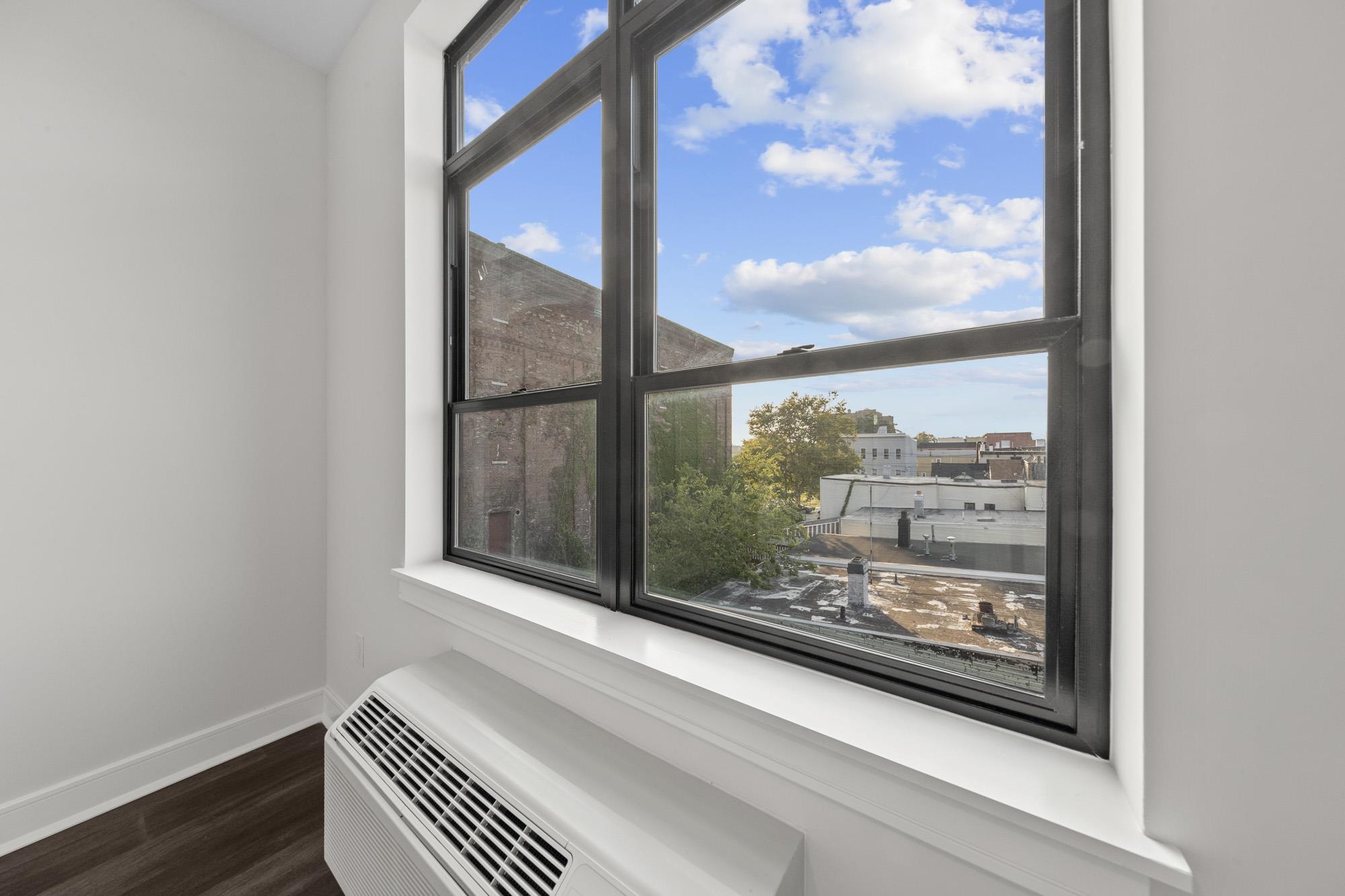 121 34th Street, Unit 415 Union City, NJ 07087 - Photo 10 of 41 a view of a room with window