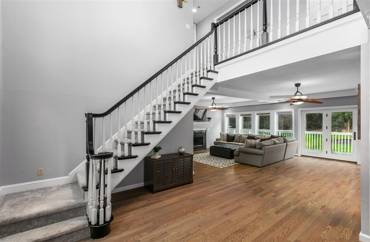 5513 Den Heider Way Raleigh, NC 27606 - Photo 3 of 30 Grand Staircase and Beautiful Wood Floors