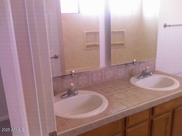 240 East Oak Street Huachuca City, AZ 85616 - Photo 12 of 43 a bathroom with a sink and a mirror