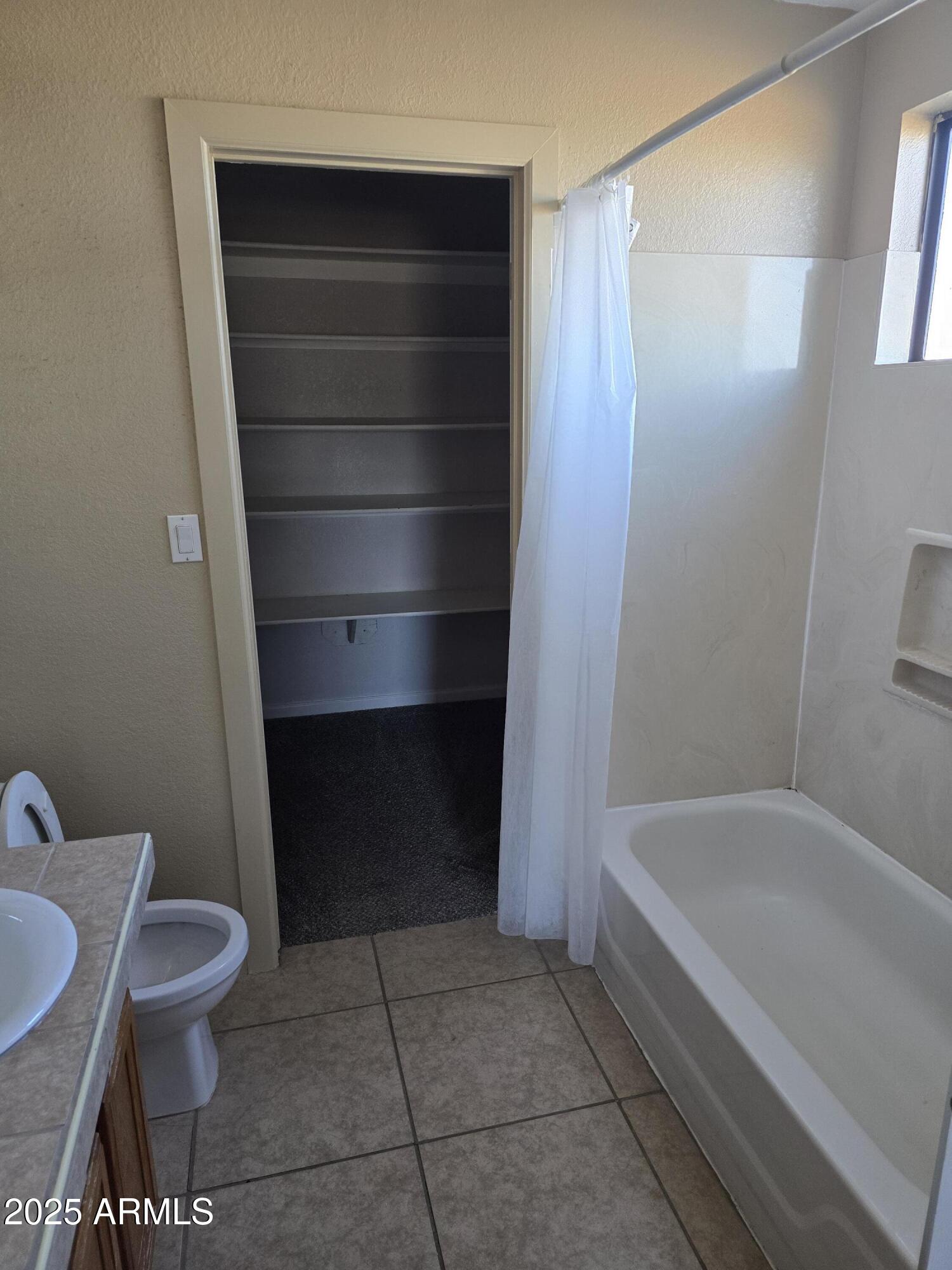 240 East Oak Street Huachuca City, AZ 85616 - Photo 13 of 43 a bathroom with a sink and a toilet