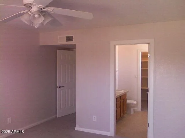 a view of a bathroom from the hallway