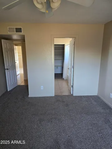 a view of a big room with windows and cabinet