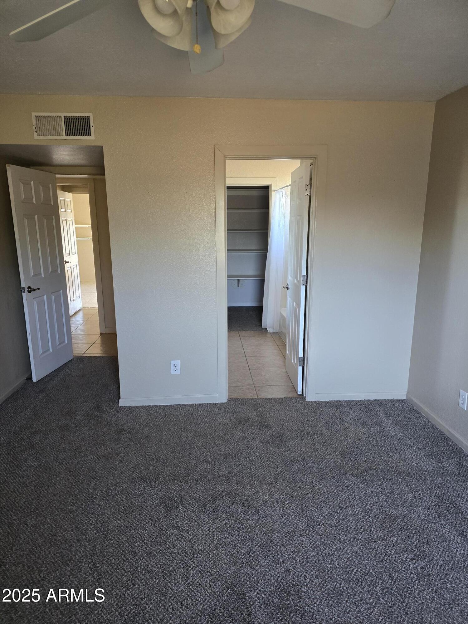 240 East Oak Street Huachuca City, AZ 85616 - Photo 17 of 43 a view of a big room with windows and cabinet