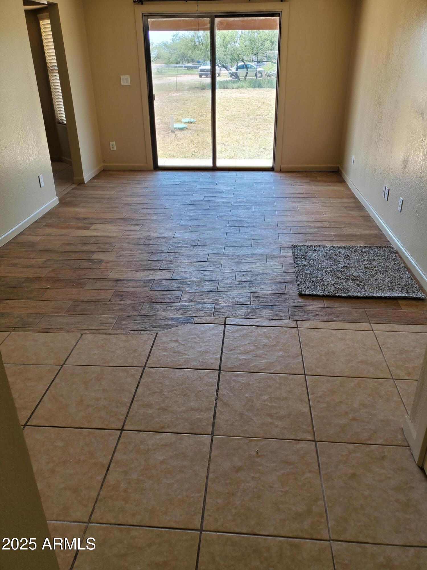 240 East Oak Street Huachuca City, AZ 85616 - Photo 18 of 43 a view of an empty room with a window