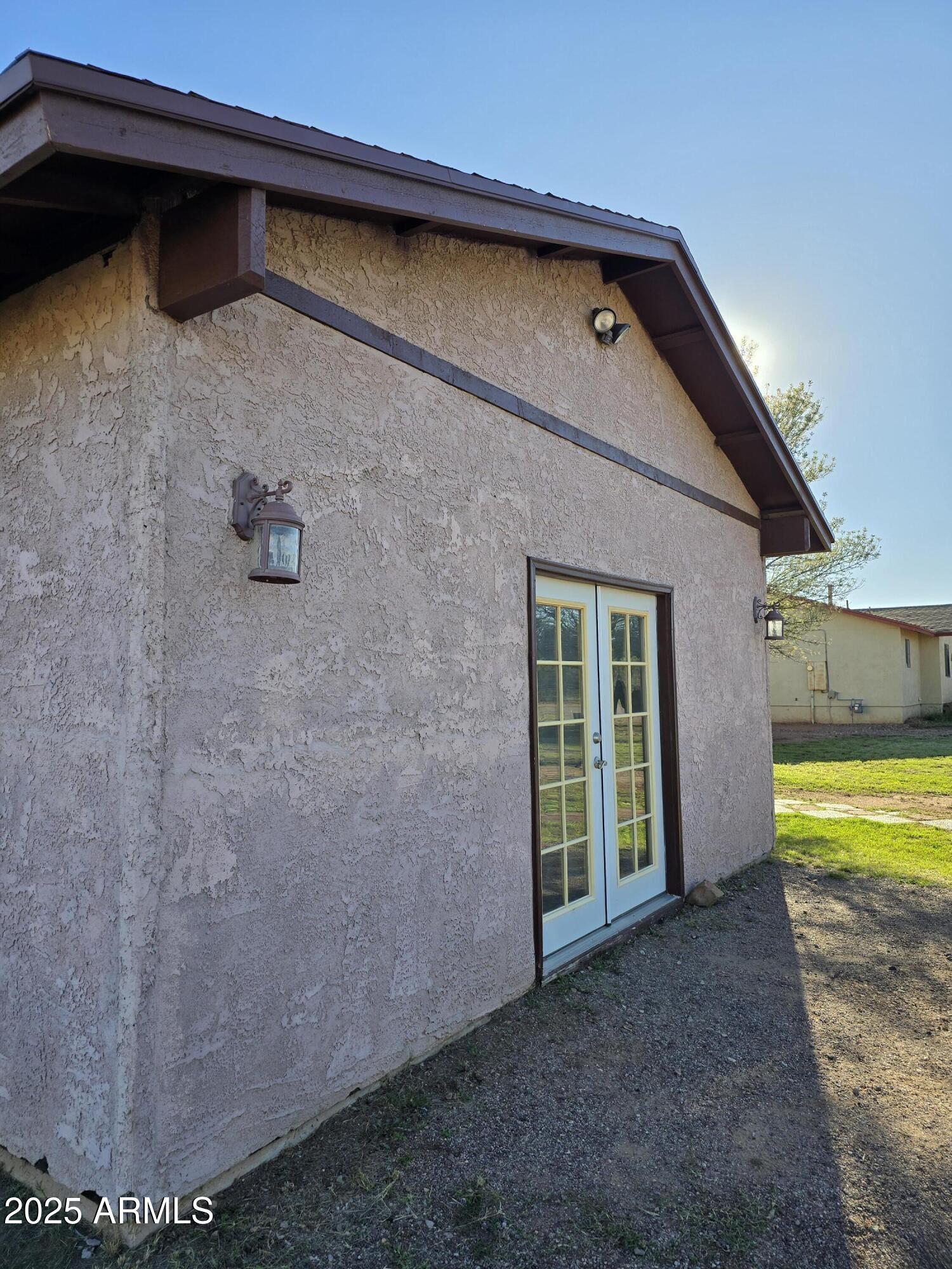 240 East Oak Street Huachuca City, AZ 85616 - Photo 3 of 43 a front view of a house with a yard